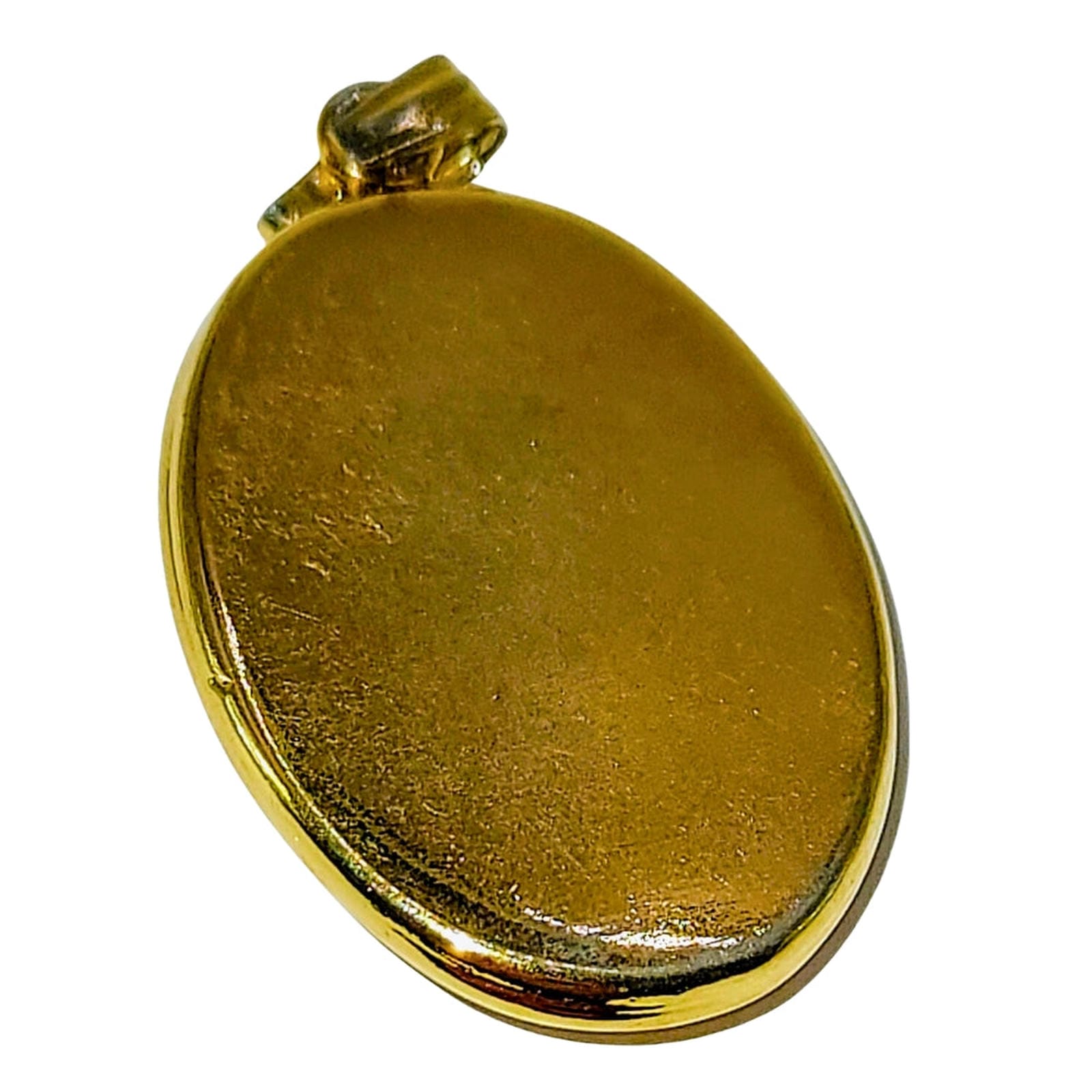 Oval Shell Cameo set in gold bezel.  Young female profile w/blossoms
