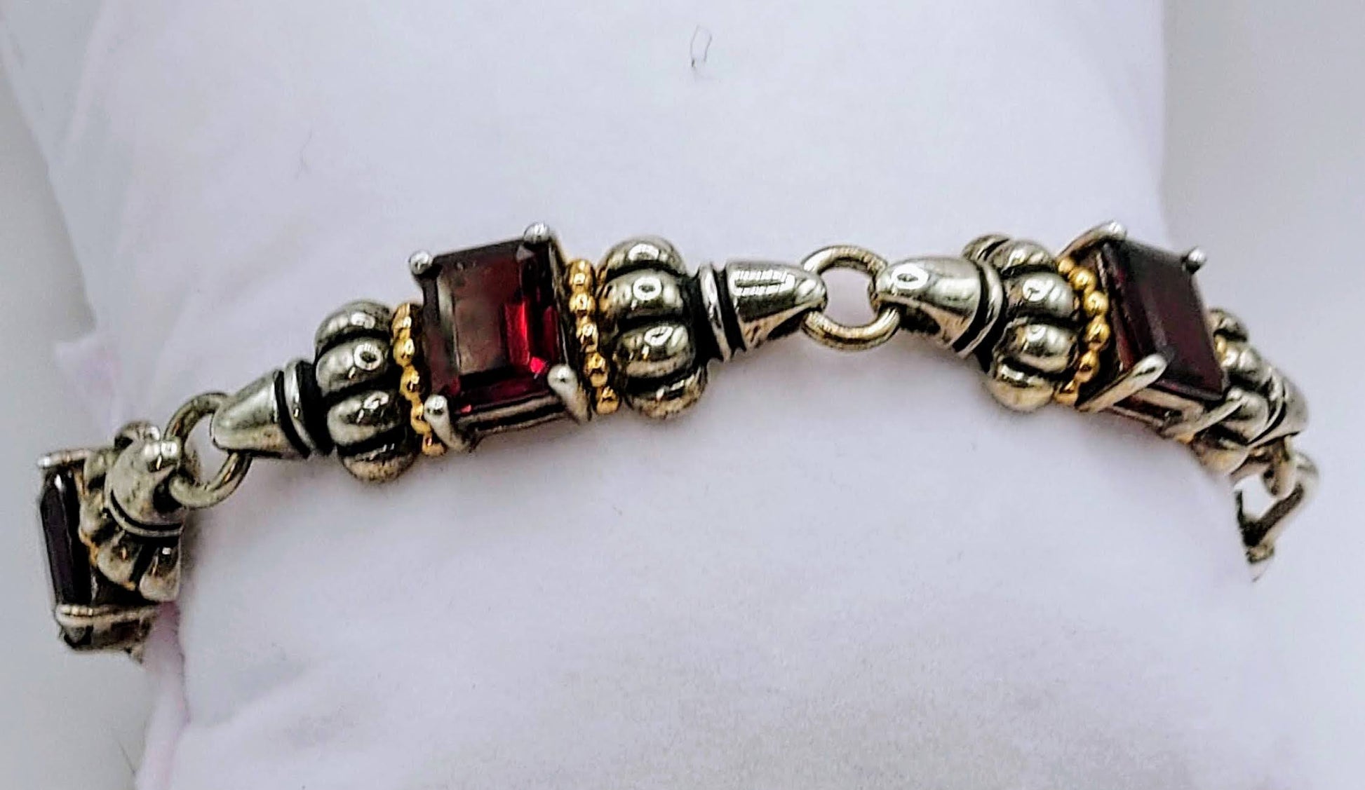 Sterling 5-segment bracelet w/square garnets and gold accents.  Swivel hook clasp.  Marked CID, 925 14K  Maker Clyde Dunier