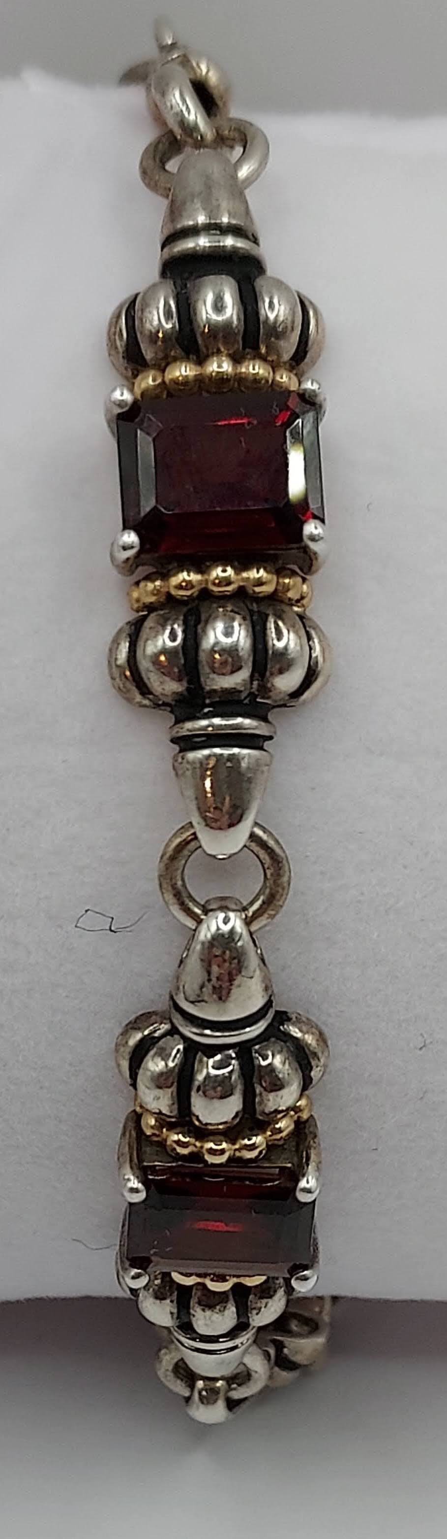 Sterling 5-segment bracelet w/square garnets and gold accents.  Swivel hook clasp.  Marked CID, 925 14K  Maker Clyde Dunier