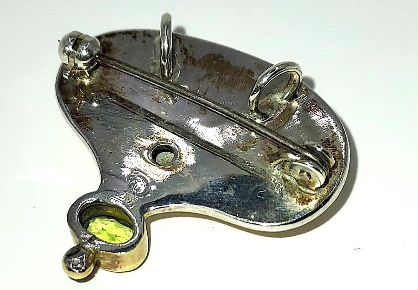 Modern silver and gold with peridot pendant/pin back