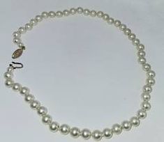 White Cultured Pearl Necklace with Chinese Symbol Clasp
